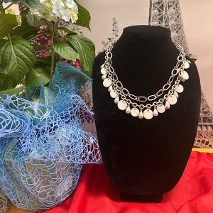 silver tone necklace with mother of pearl shell